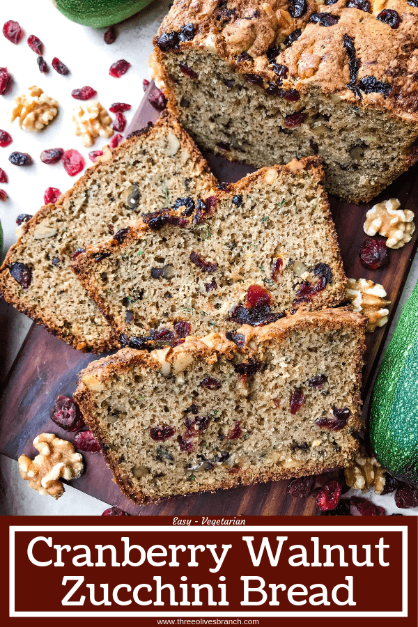 Cranberry Walnut Zucchini Bread is a simple bread filled with shredded courgette zucchini squash, dried cranberries, and chopped walnuts. A warm, spiced bread, this recipe is great as a snack or toasted with some butter. Vegetarian bread recipe.