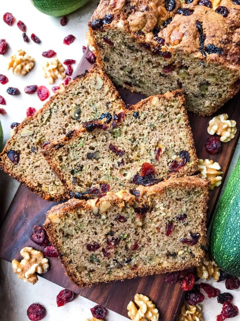 Cranberry Walnut Zucchini Bread is a simple bread filled with shredded courgette zucchini squash, dried cranberries, and chopped walnuts. A warm, spiced bread, this recipe is great as a snack or toasted with some butter. Vegetarian bread recipe.
