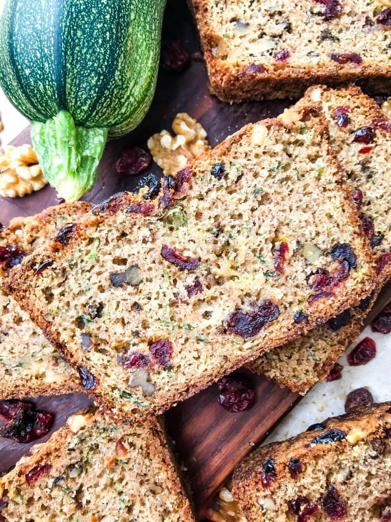 Cranberry Walnut Zucchini Bread is a simple bread filled with shredded courgette zucchini squash, dried cranberries, and chopped walnuts. A warm, spiced bread, this recipe is great as a snack or toasted with some butter. Vegetarian bread recipe.