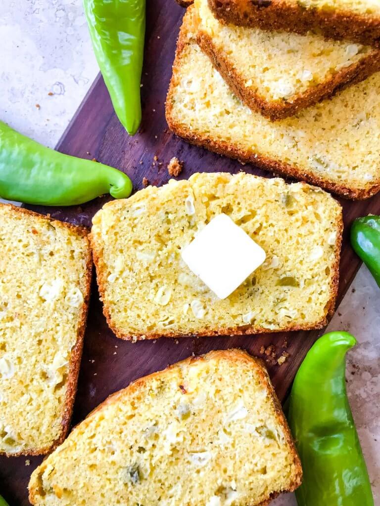 Slice of Hatch Green Chile Cheddar Cornbread with butter on it