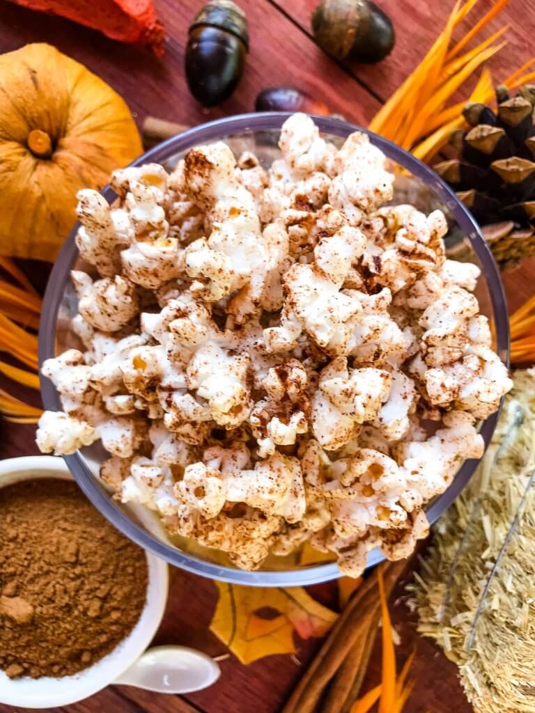This Homemade Pumpkin Spice Popcorn is ready in just 10 minutes! A sweet and savory pumpkin spice is sprinkled across fresh homemade popcorn for a fast and easy snack recipe. Gluten free, vegan, and vegetarian. #pumpkinspice #fallsnacks #fallrecipes