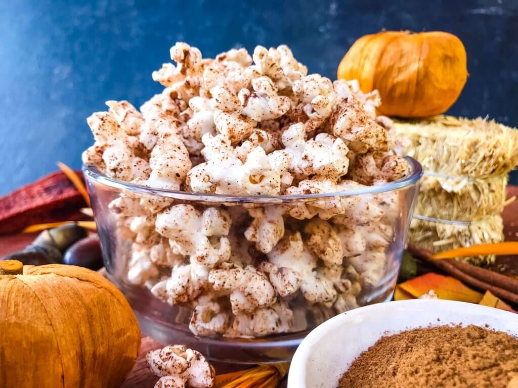 This Homemade Pumpkin Spice Popcorn is ready in just 10 minutes! A sweet and savory pumpkin spice is sprinkled across fresh homemade popcorn for a fast and easy snack recipe. Gluten free, vegan, and vegetarian. #pumpkinspice #fallsnacks #fallrecipes