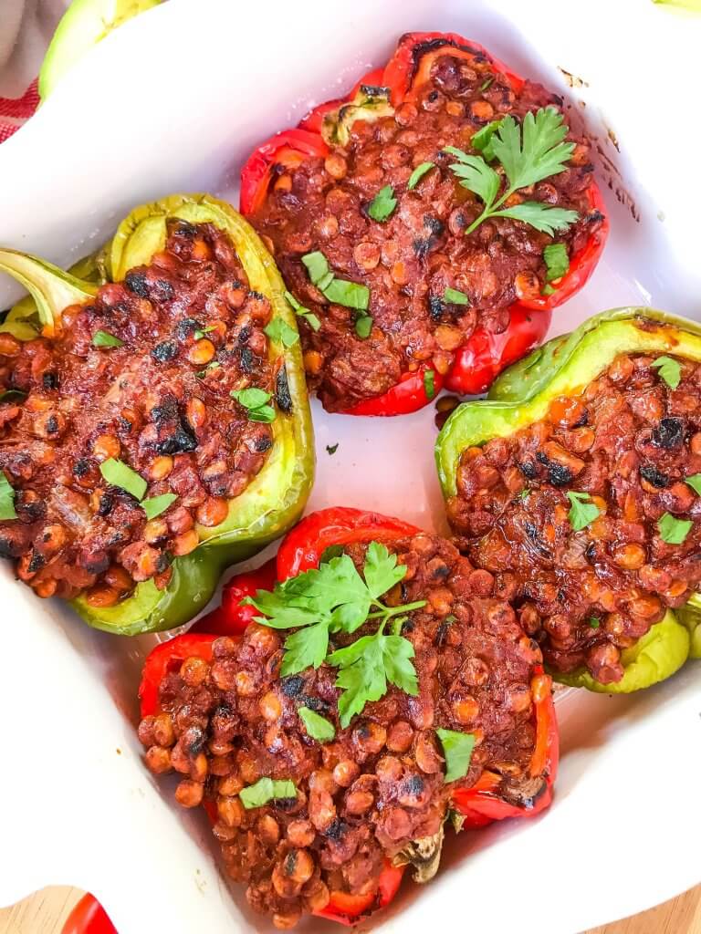 Vegan Lentil Taco Stuffed Peppers are bell peppers stuffed with lentils cooked in a taco tomato sauce. Vegan stuffed peppers are gluten free and vegetarian Mexican food recipe. #veganstuffedpeppers #stuffedpeppers #vegantacos