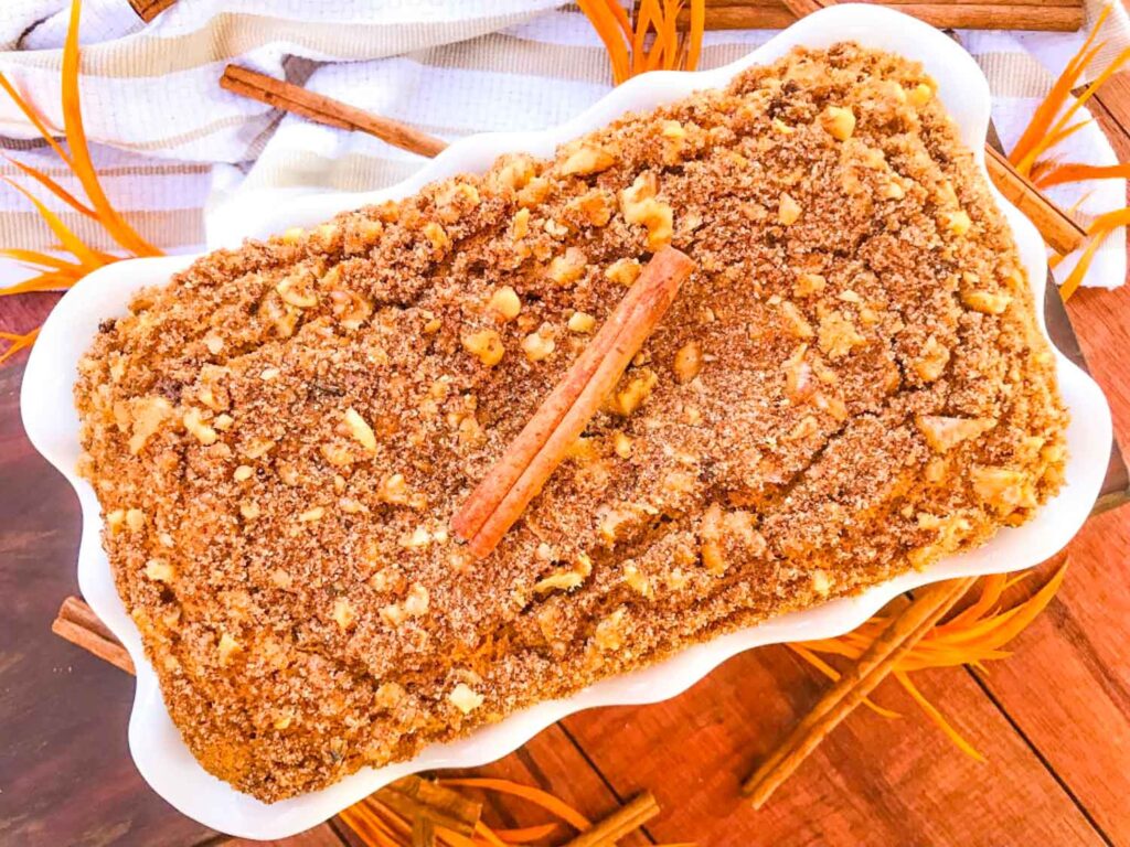 A oaf of Cinnamon Streusel Pumpkin Bread in a white dish from the top view