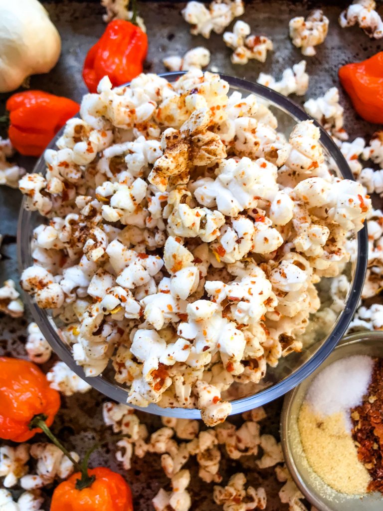 This Homemade Habanero Garlic Spicy Popcorn is a spicy snack recipe great for entertaining, party food, and game day. Vegan, vegetarian, gluten free. use any ground pepper with garlic powder and salt for a seasoning kick. #homemadepopcorn #spicyrecipe #spicyfood