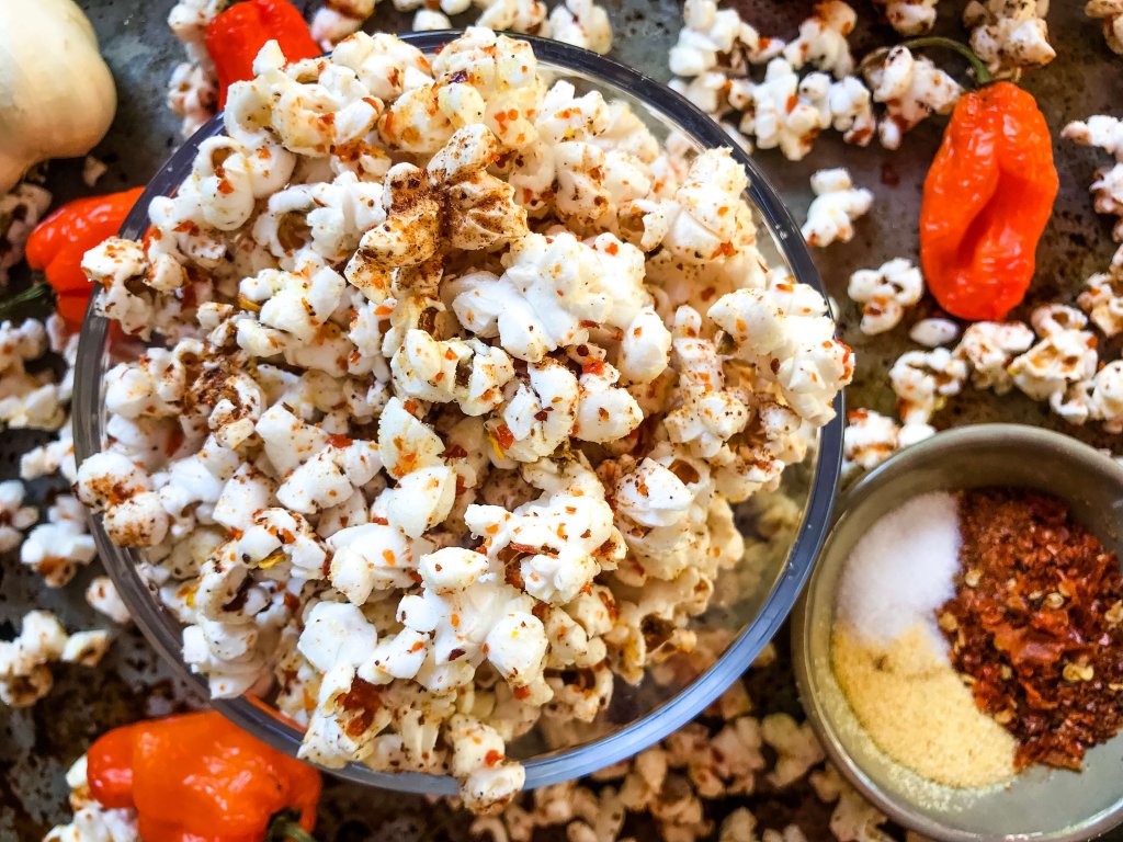 This Homemade Habanero Garlic Spicy Popcorn is a spicy snack recipe great for entertaining, party food, and game day. Vegan, vegetarian, gluten free. use any ground pepper with garlic powder and salt for a seasoning kick. #homemadepopcorn #spicyrecipe #spicyfood