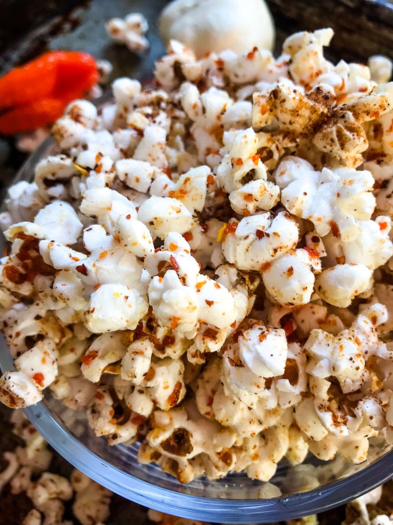 This Homemade Habanero Garlic Spicy Popcorn is a spicy snack recipe great for entertaining, party food, and game day. Vegan, vegetarian, gluten free. use any ground pepper with garlic powder and salt for a seasoning kick. #homemadepopcorn #spicyrecipe #spicyfood