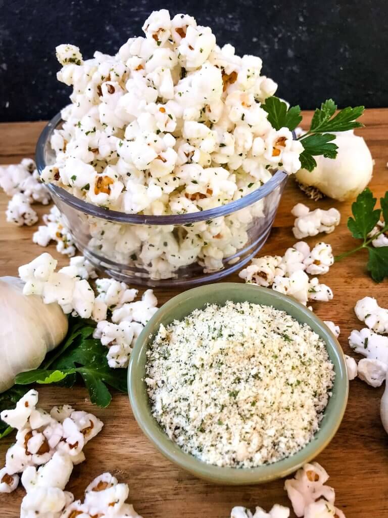 Ready in 10 minutes, Homemade Parmesan Garlic Popcorn is a fast and easy snack recipe. Parmesan cheese, garlic powder, and parsley season this healthy, gluten free, vegetarian appetizer. Great for party entertaining and game day. #homemadepopcorn #gamedayrecipes
