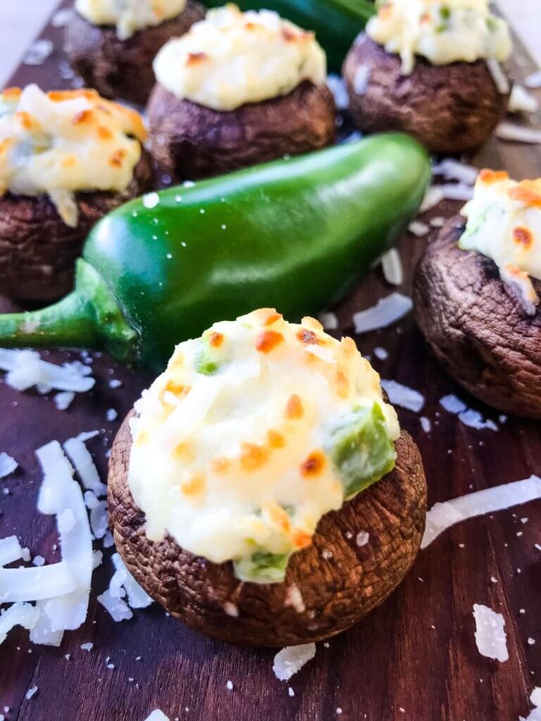 Jalapeno Popper Stuffed Mushrooms are a perfect game day appetizer.  A cream cheese mixture is combined with chopped jalapeno peppers and stuffed in mushroom caps.  Gluten free, low carb keto, and vegetarian. #gameday #jalapenopoppers #stuffedmushrooms