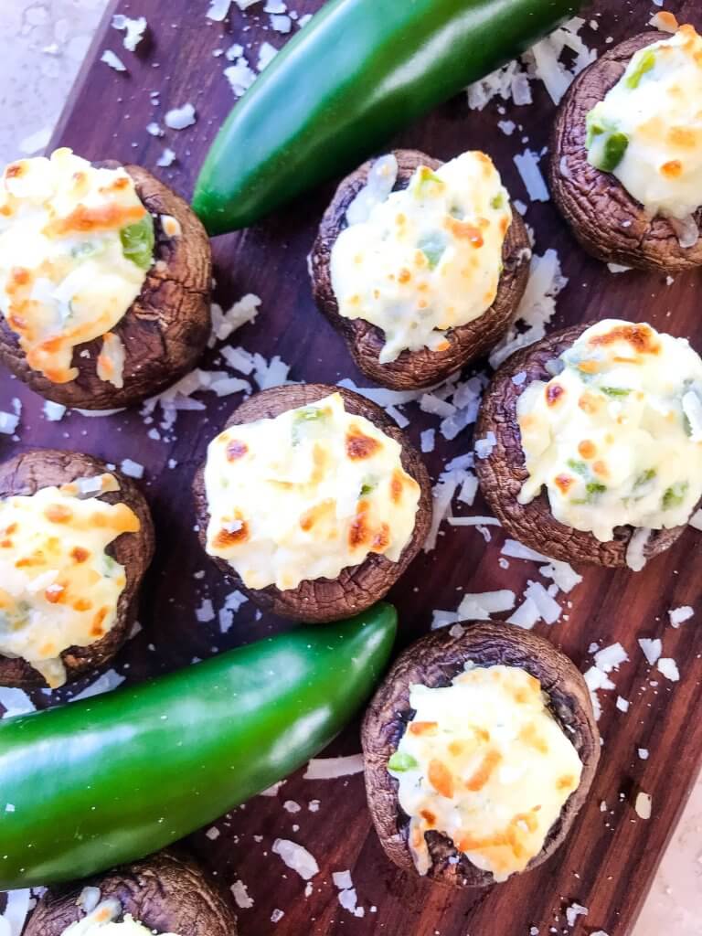 Jalapeno Popper Stuffed Mushrooms are a perfect game day appetizer.  A cream cheese mixture is combined with chopped jalapeno peppers and stuffed in mushroom caps.  Gluten free, low carb keto, and vegetarian. #gameday #jalapenopoppers #stuffedmushrooms