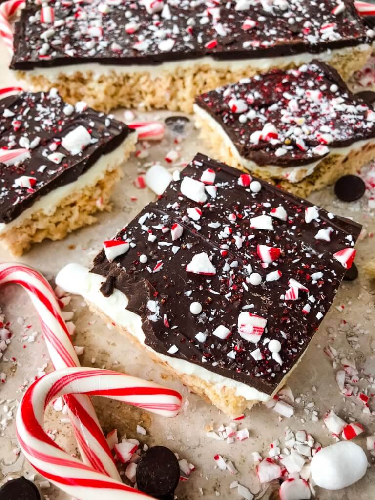 Peppermint Bark Rice Krispie Treats surrounded by candy cane pieces