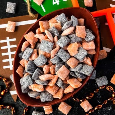 Top view of Cincinnati Bengals Puppy Chow in a football bowl on a football decorated table