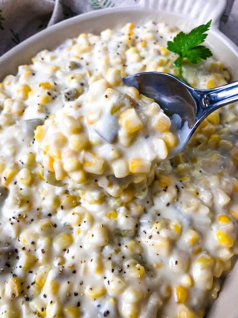 A spoon full of Hatch Green Chile Creamed Corn