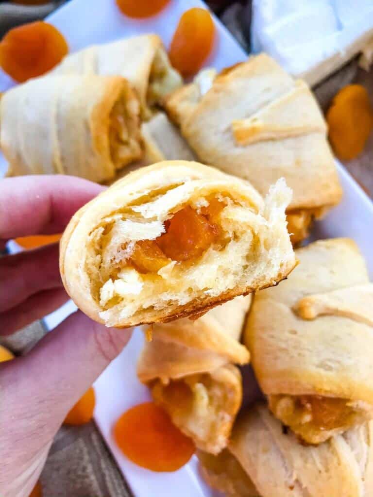 Apricot Brie Crescent Rolls are a cheese crescent roll recipe filled with apricot jam, dried apricots, and brie cheese. Fast and easy sweet bread recipe. #crescentrolls #cheesycrescentrolls #driedapricots