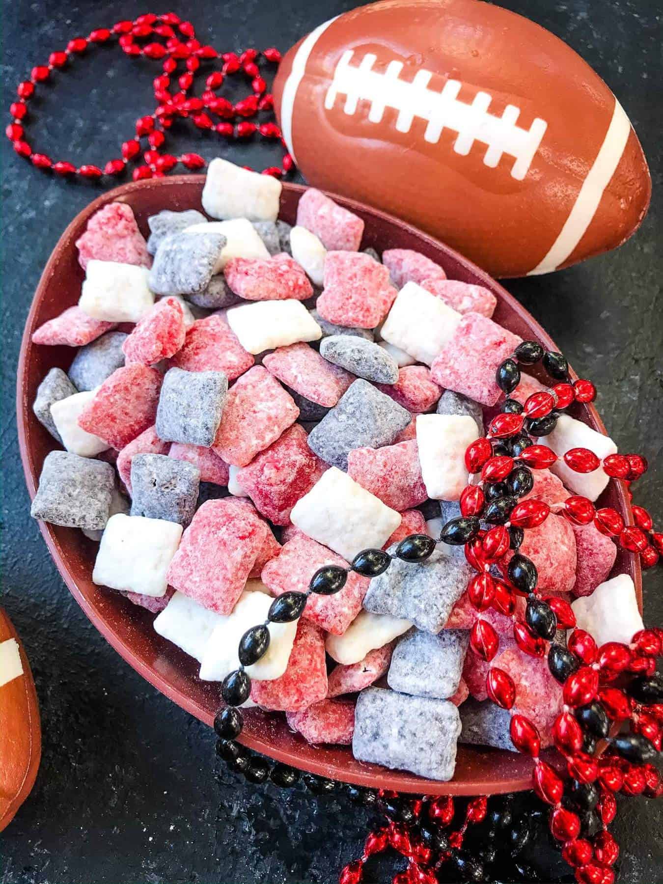 Atlanta Falcons Puppy Chow colors mixed in a football shaped bowl