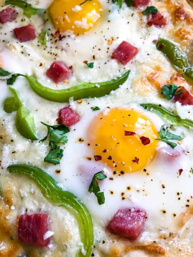 This Denver Omelet Pizza is ready in just 30 minutes using Fleischmann’s® RapidRise® Yeast, topped with a white sauce, ham, green bell peppers, and eggs. #HomemadePizzaCrust #homemadepizza