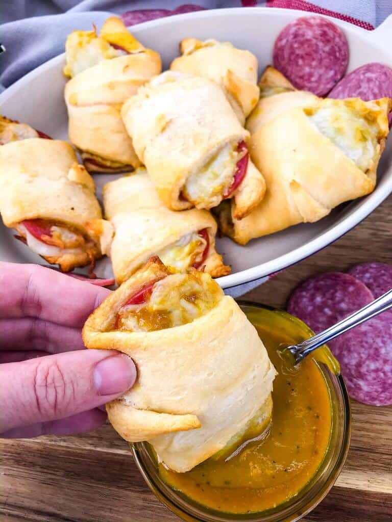 Cheesy Mustard Salami Crescent Rolls are filled with Margherita® Genoa Salami, cheese, and a simple mustard sauce served with more mustard sauce for dipping! An easy and fast appetizer recipe for party entertaining and game day or snack. #crescentrolls #salami #appetizerrecipes