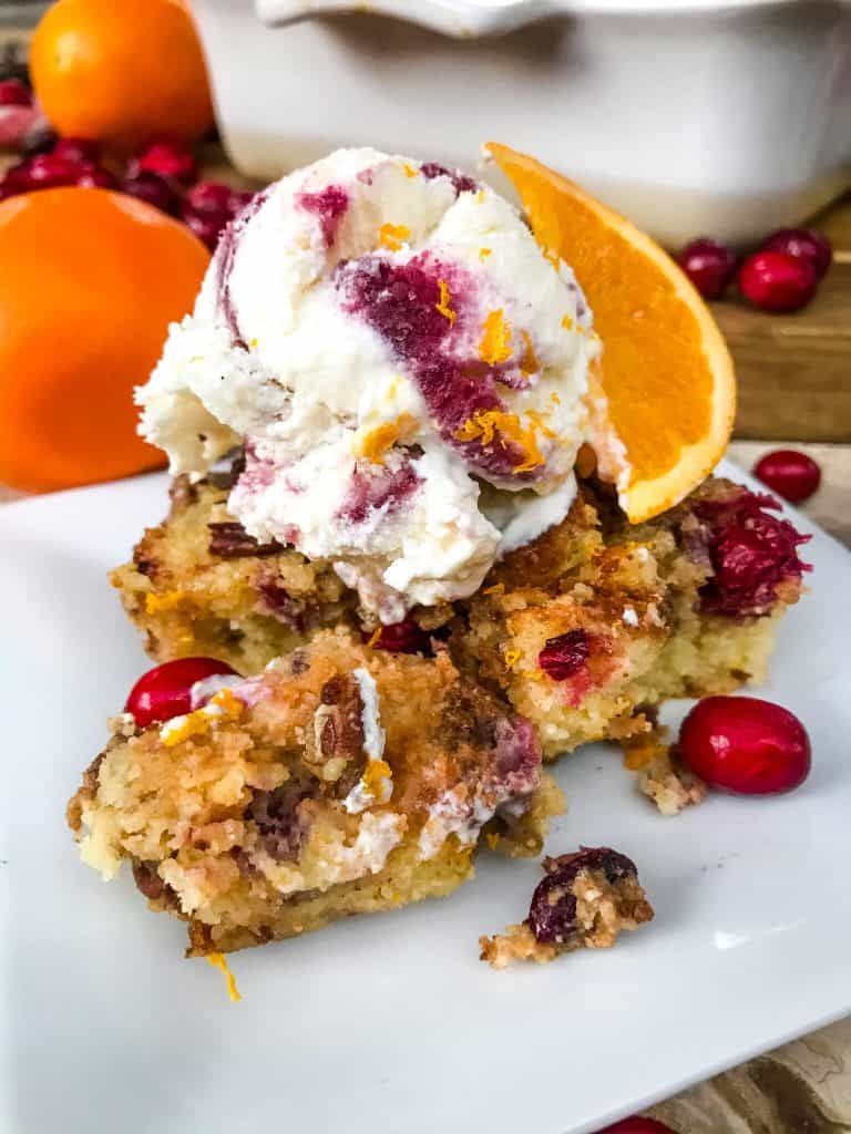 Cranberry Orange Bread Pudding is a delicious bread pudding recipe full of fresh orange and cranberries. Make in advance and serve up with ice cream for a special event or holiday dessert. #breadpudding #cranberryorange #holidaydessert