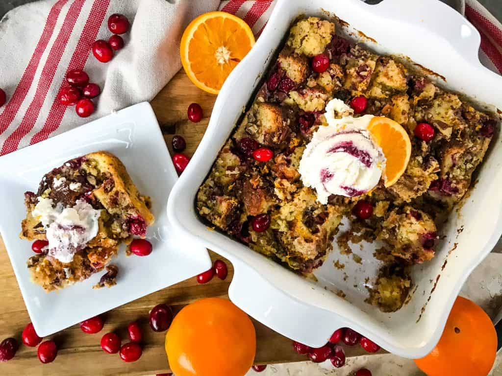 Cranberry Orange Bread Pudding is a delicious bread pudding recipe full of fresh orange and cranberries. Make in advance and serve up with ice cream for a special event or holiday dessert. #breadpudding #cranberryorange #holidaydessert