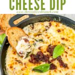 Pin of Tuscan Cheese Dip in a skillet with title at top