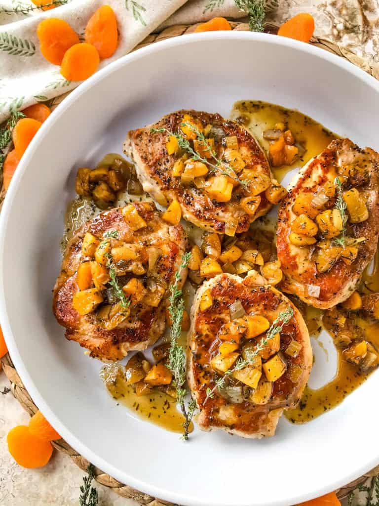 Stove top Bourbon Apricot Pork Chops recipe is a fast weeknight dinner made in one pot. A pan sauce of bourbon and dried apricots with seared pork served with rice, potatoes, or vegetables. Gluten free and dairy free, ready in 30 minutes. Easy pan seared pork chops. #porkchops #stovetopporkchops Stove top Bourbon Apricot Pork Chops recipe is a fast weeknight dinner made in one pot. A pan sauce of bourbon and dried apricots with seared pork served with rice, potatoes, or vegetables. Gluten free and dairy free, ready in 30 minutes. Easy pan seared pork chops. #porkchops #stovetopporkchops
