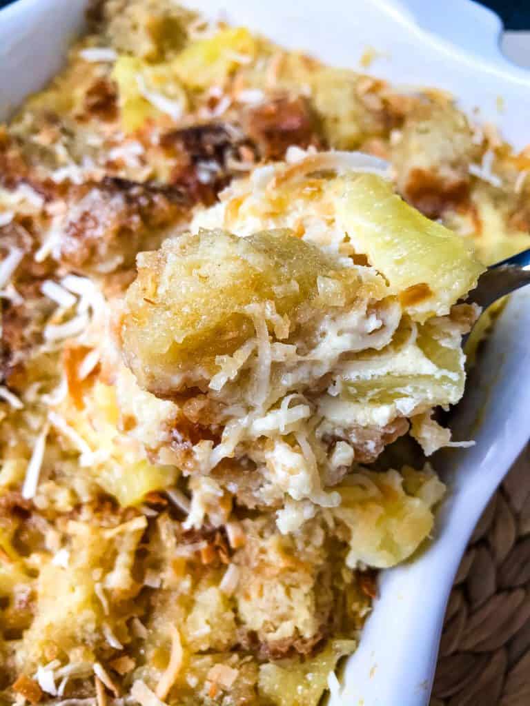 Pina Colada Bread Pudding is full of pineapple, coconut, and rum in a simple dessert recipe. A sweet take on the rum cocktail. #pineapplecoconut #pinacolada #breadpudding