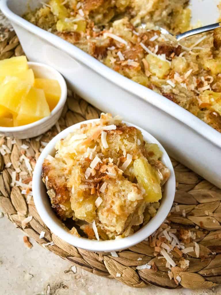 Pina Colada Bread Pudding is full of pineapple, coconut, and rum in a simple dessert recipe. A sweet take on the rum cocktail. #pineapplecoconut #pinacolada #breadpudding