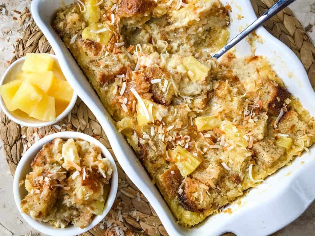 Pina Colada Bread Pudding is full of pineapple, coconut, and rum in a simple dessert recipe. A sweet take on the rum cocktail. #pineapplecoconut #pinacolada #breadpudding