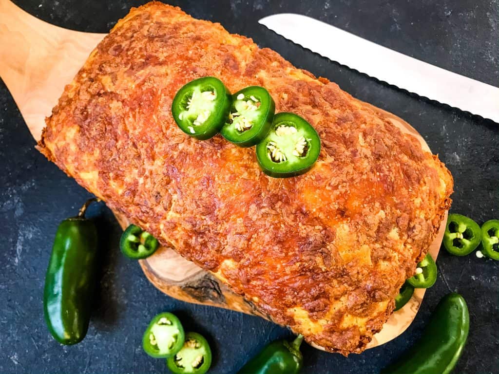 Jalapeno Cornbread is a quick bread recipe filled with peppers, corn, and cheese. Great side dish for BBQ or southern food. #jalapenopopper #cornbread