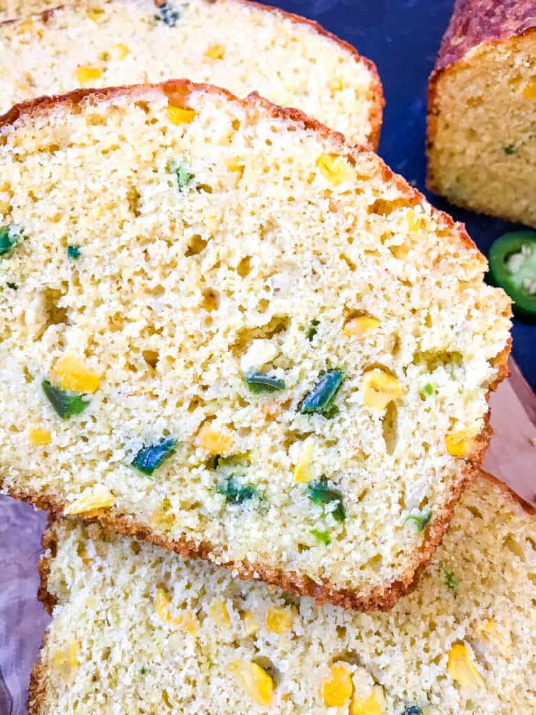 Jalapeno Cornbread is a quick bread recipe filled with peppers, corn, and cheese. Great side dish for BBQ or southern food. #jalapenopopper #cornbread