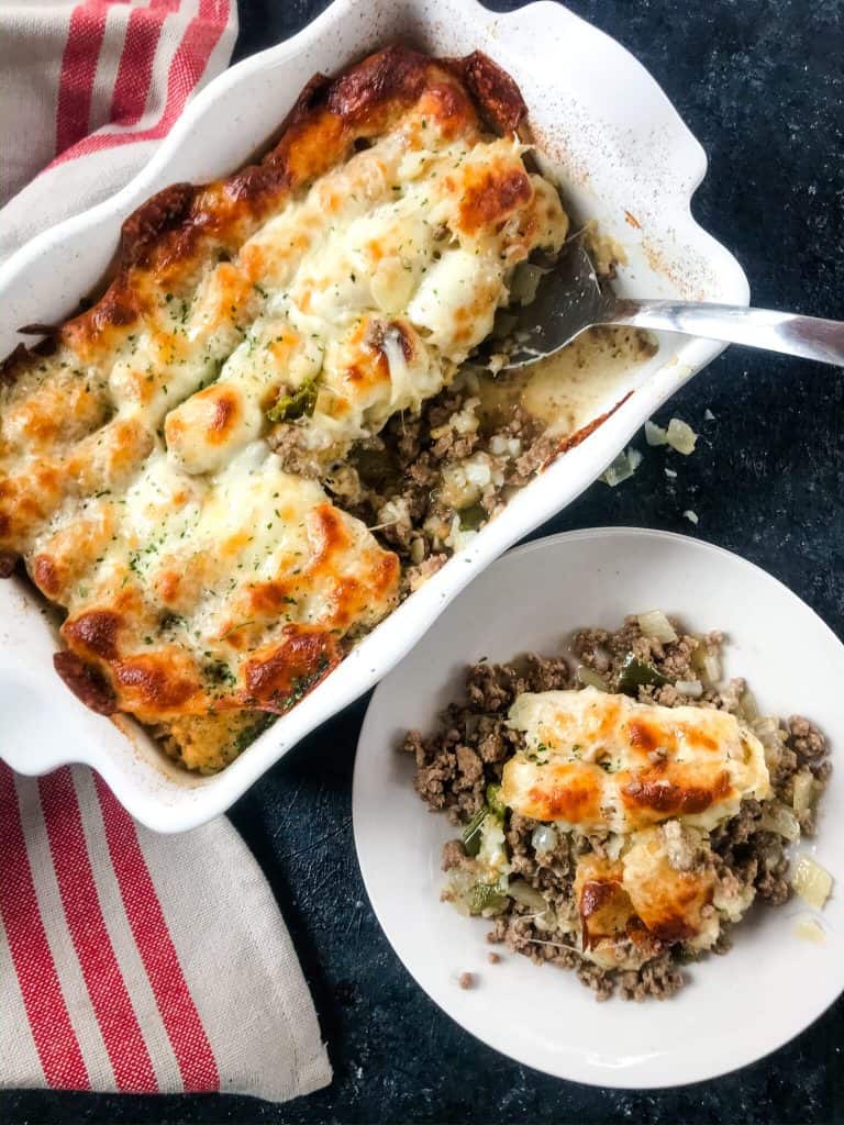 Philly Cheesesteak Tater Tot Casserole is a cheesy beef casserole recipe mixed with onion, green bell pepper, provolone cheese, and potato tater tots. An easy dinner idea for busy nights for the family. #beefcasserole #cheesesteak #hamburgercasserole