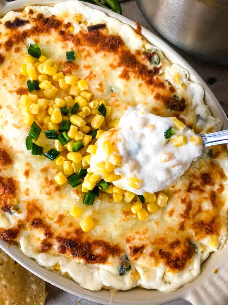 Warm Corn Cheese Dip is packed with three cheeses and corn for a fast and easy appetizer recipe. It takes just minutes to make this vegetarian and gluten free corn dip for a party, game day, or holiday appetizer. #corndip #cheesedip