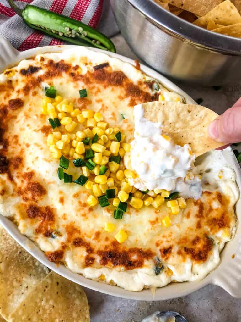 Warm Corn Cheese Dip is packed with three cheeses and corn for a fast and easy appetizer recipe. It takes just minutes to make this vegetarian and gluten free corn dip for a party, game day, or holiday appetizer. #corndip #cheesedip