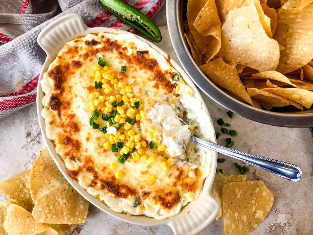 Warm Corn Cheese Dip is packed with three cheeses and corn for a fast and easy appetizer recipe. It takes just minutes to make this vegetarian and gluten free corn dip for a party, game day, or holiday appetizer. #corndip #cheesedip