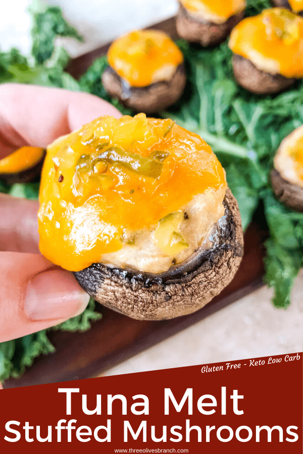 Pin image of a hand holding Tuna Melt Stuffed Mushrooms with title at bottom