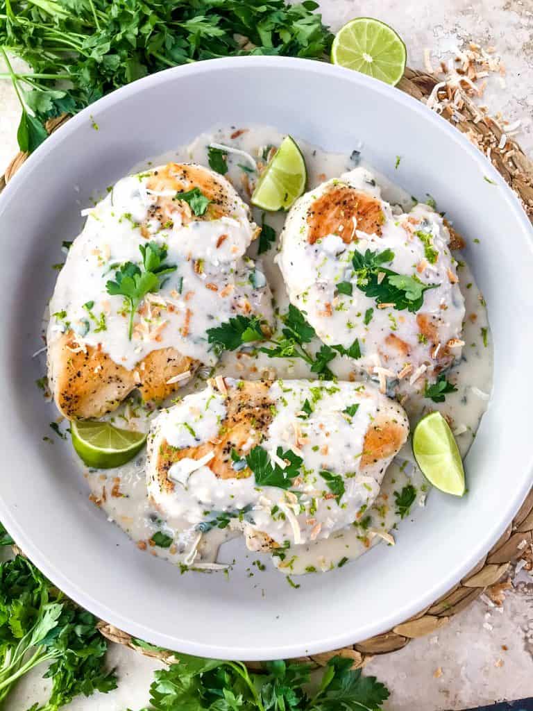 Coconut Lime Chicken is ready in 30 minutes! A skillet chicken recipe with a quick coconut lime pan sauce. Dairy free, gluten free, and keto low carb. Fast easy chicken dinner. #chickenrecipes #30minutemeals #coconutchicken