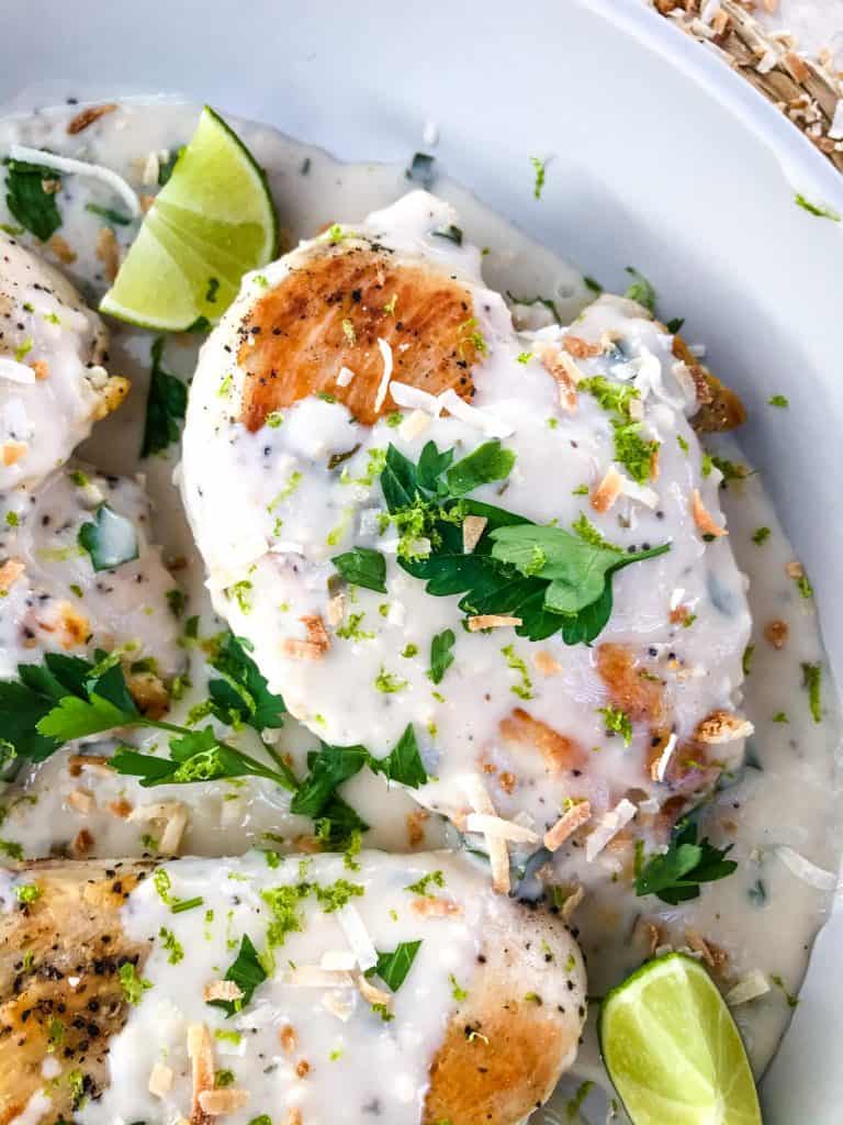 Coconut Lime Chicken is ready in 30 minutes! A skillet chicken recipe with a quick coconut lime pan sauce. Dairy free, gluten free, and keto low carb. Fast easy chicken dinner. #chickenrecipes #30minutemeals #coconutchicken