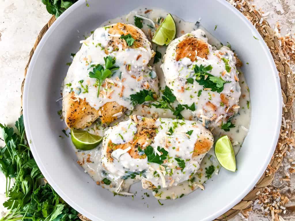 Coconut Lime Chicken is ready in 30 minutes! A skillet chicken recipe with a quick coconut lime pan sauce. Dairy free, gluten free, and keto low carb. Fast easy chicken dinner. #chickenrecipes #30minutemeals #coconutchicken