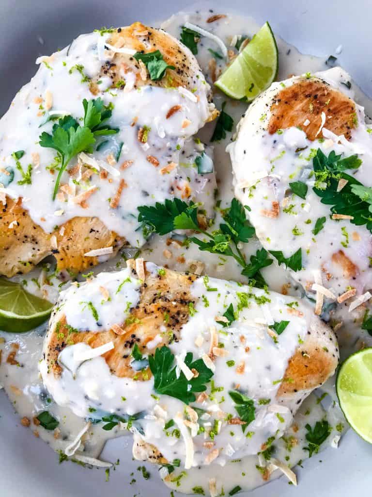 Coconut Lime Chicken is ready in 30 minutes! A skillet chicken recipe with a quick coconut lime pan sauce. Dairy free, gluten free, and keto low carb. Fast easy chicken dinner. #chickenrecipes #30minutemeals #coconutchicken