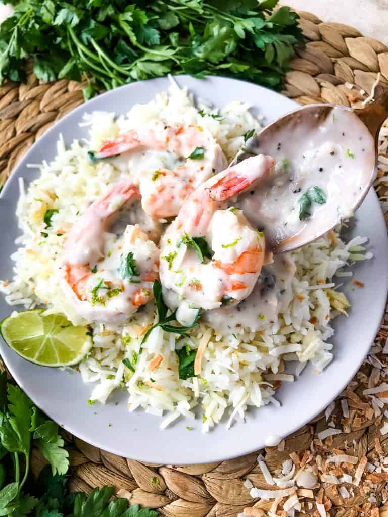 Coconut Lime Shrimp is ready in just 20 minutes! Gluten free and low carb Keto shrimp recipe cooked in a simple coconut milk and lime sauce. Serve with coconut rice. #coconutshrimp #coconutlime #shrimprecipe