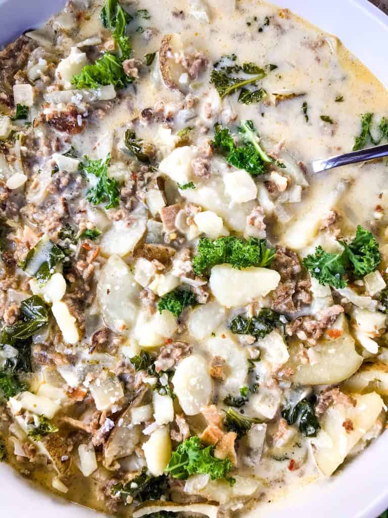Copycat Olive Garden Zuppa Toscana in a white bowl, closer up