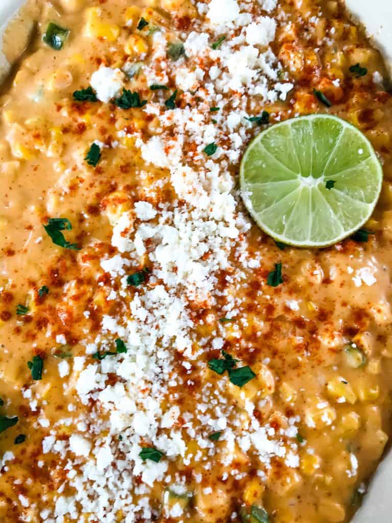 Mexican Street Corn Elote Creamed Corn is a simple homemade creamed corn recipe perfect for a Mexican, BBQ or Southern soul food meal. Corn is cooked with jalapeno, chili powder, lime, milk, and butter for a simple side dish. #creamedcorn #elote #mexicanstreetcorn