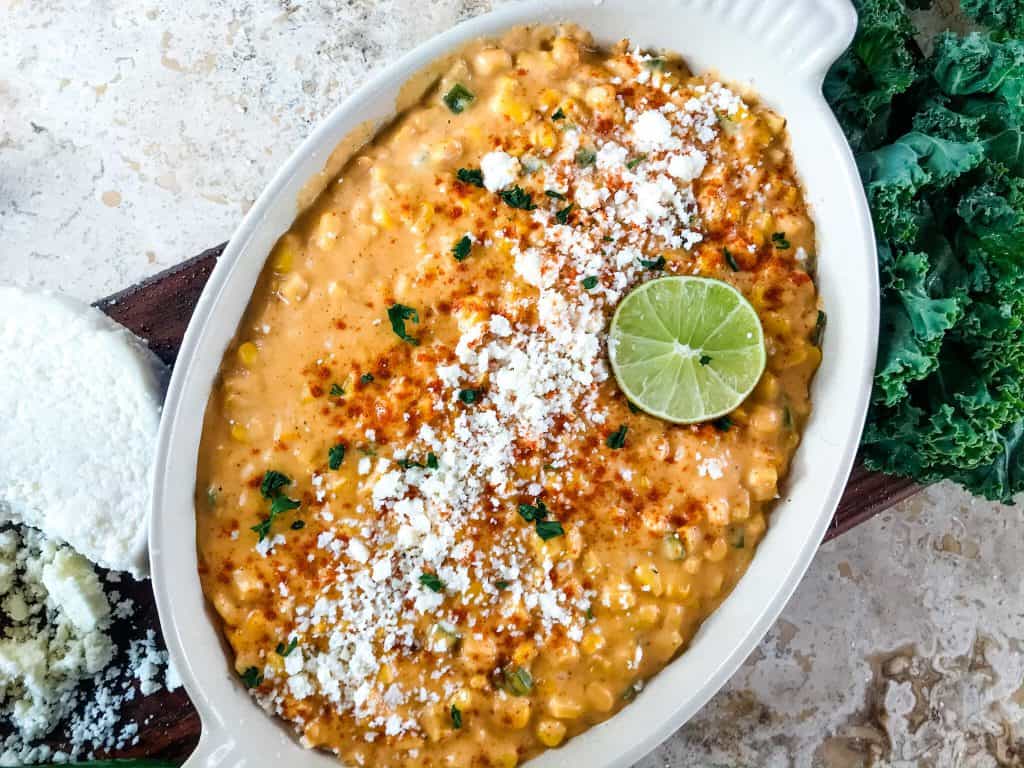 Mexican Street Corn Elote Creamed Corn is a simple homemade creamed corn recipe perfect for a Mexican, BBQ or Southern soul food meal. Corn is cooked with jalapeno, chili powder, lime, milk, and butter for a simple side dish. #creamedcorn #elote #mexicanstreetcorn