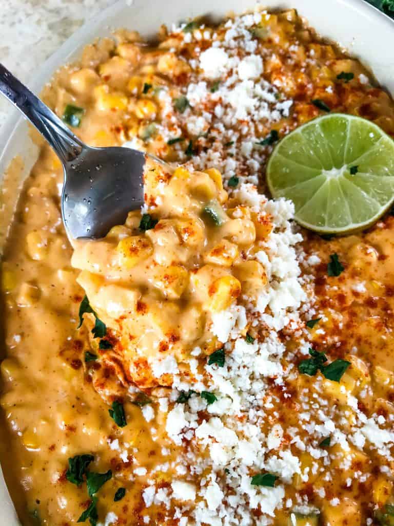 Mexican Street Corn Elote Creamed Corn is a simple homemade creamed corn recipe perfect for a Mexican, BBQ or Southern soul food meal. Corn is cooked with jalapeno, chili powder, lime, milk, and butter for a simple side dish. #creamedcorn #elote #mexicanstreetcorn