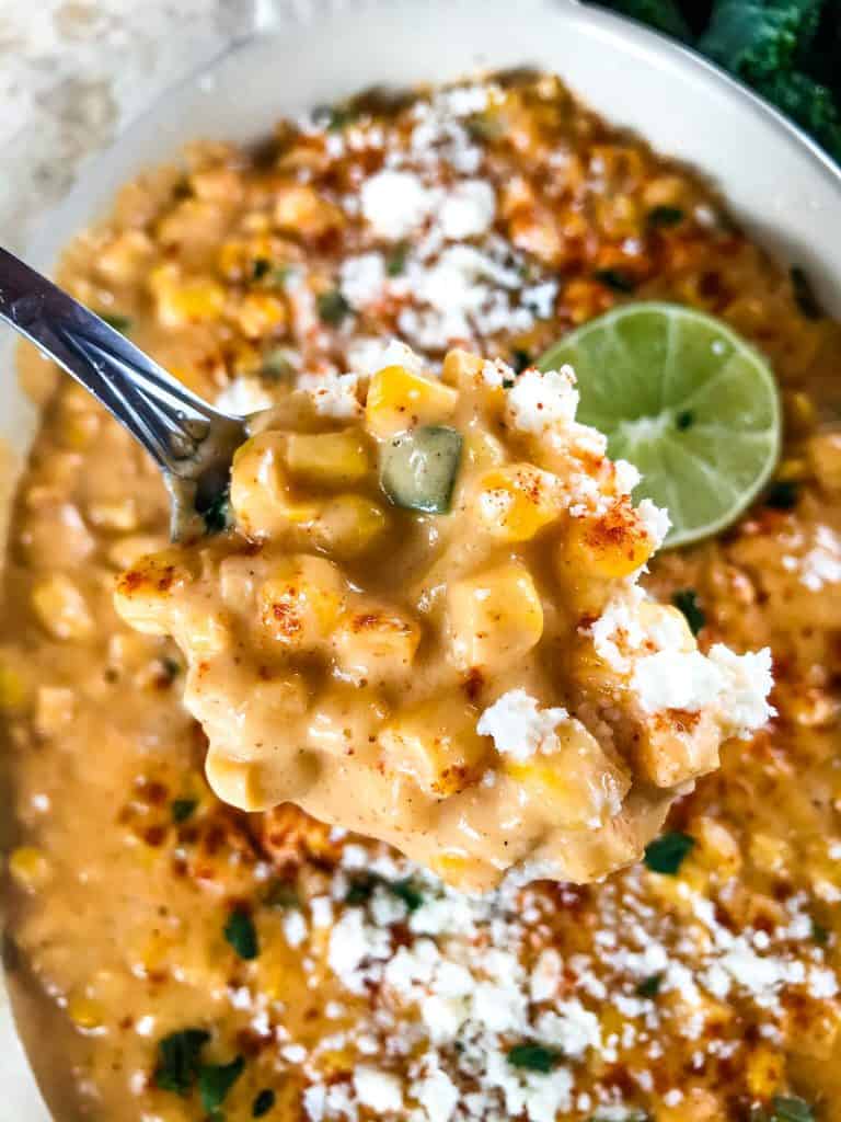 Mexican Street Corn Elote Creamed Corn is a simple homemade creamed corn recipe perfect for a Mexican, BBQ or Southern soul food meal. Corn is cooked with jalapeno, chili powder, lime, milk, and butter for a simple side dish. #creamedcorn #elote #mexicanstreetcorn