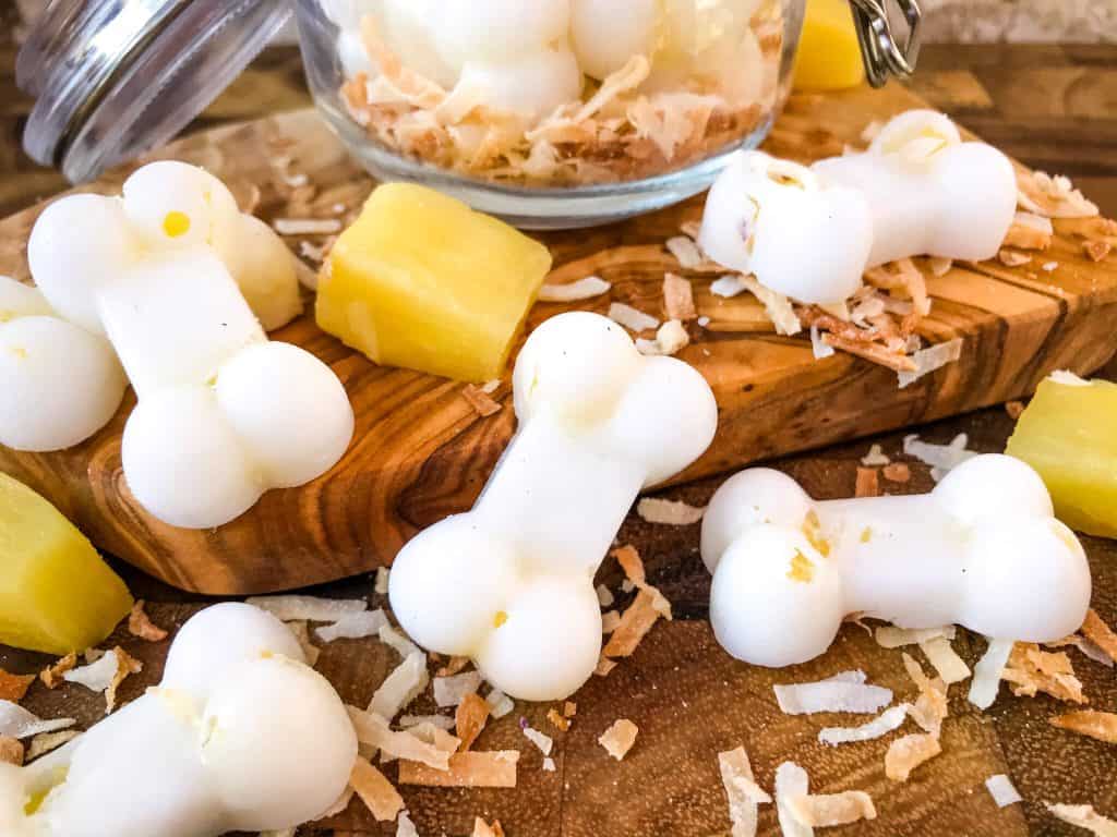 Frozen Pina Colada Dog Treats are a simple, healthy, easy DIY homemade dog treat recipe made with pineapple, coconut, and coconut oil which is great for their fur and skin. Check with your vet for any concerns. #homemadedogtreats #coconutoil #diydogtreats