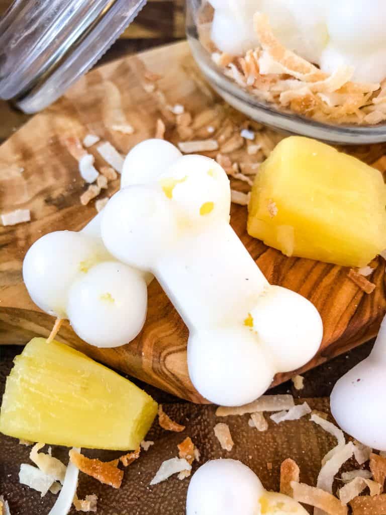 Frozen Pina Colada Dog Treats are a simple, healthy, easy DIY homemade dog treat recipe made with pineapple, coconut, and coconut oil which is great for their fur and skin. Check with your vet for any concerns. #homemadedogtreats #coconutoil #diydogtreats