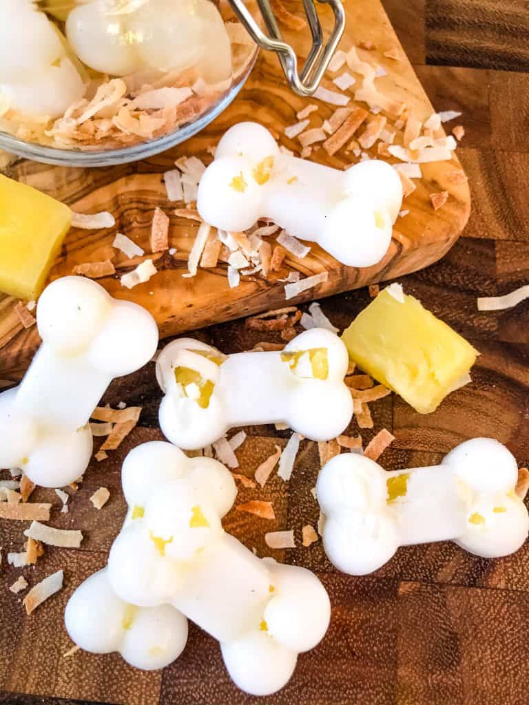 Frozen Pina Colada Dog Treats are a simple, healthy, easy DIY homemade dog treat recipe made with pineapple, coconut, and coconut oil which is great for their fur and skin. Check with your vet for any concerns. #homemadedogtreats #coconutoil #diydogtreats