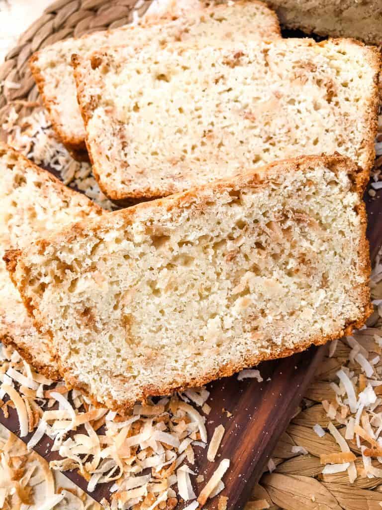 This Quick Coconut Bread recipe is easy to make and vegan! Full of coconut milk, coconut oil, and toasted shredded coconut. #veganbread #coconut #quickbread