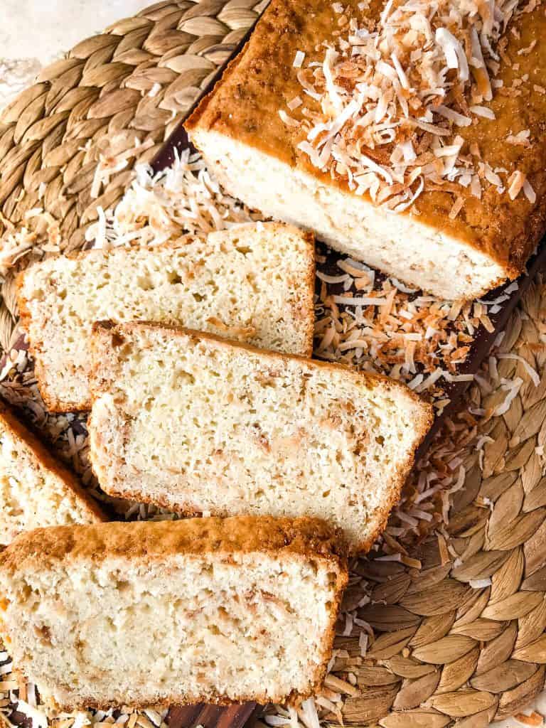 This Quick Coconut Bread recipe is easy to make and vegan! Full of coconut milk, coconut oil, and toasted shredded coconut. #veganbread #coconut #quickbread